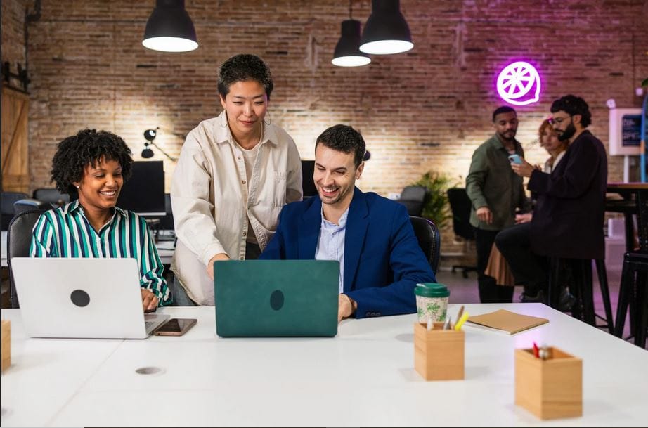 Man and woman working on laptop — Canada Start-Up Visa for Indian Entrepreneurs.