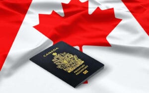 IRCC and International Mobility Program – Canadian flag and work passport.